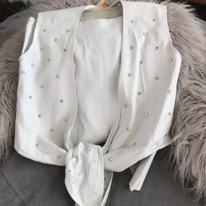 Tailor made skirt and vest.